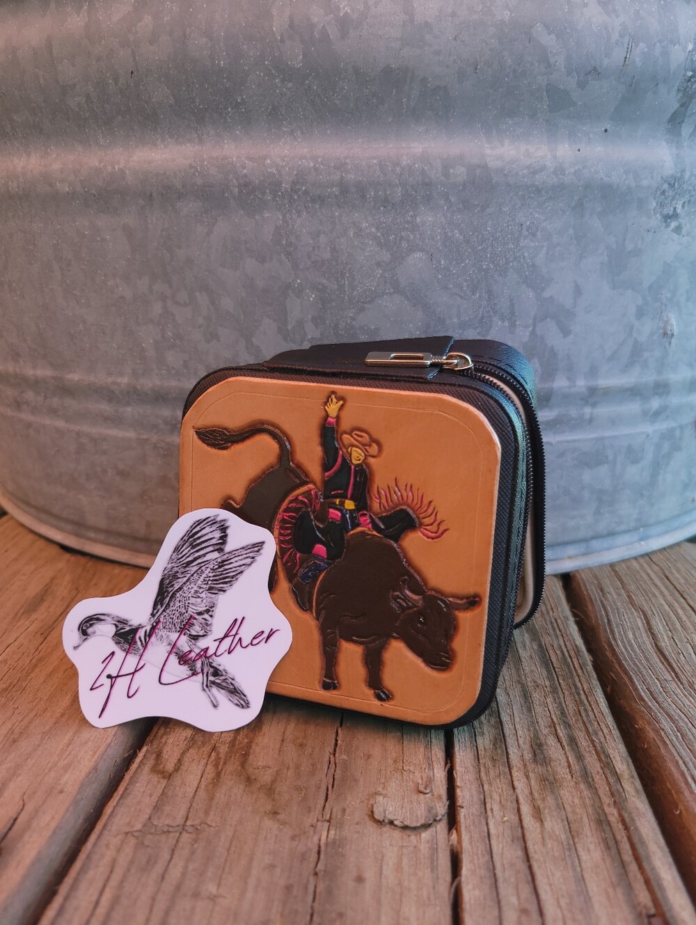 Tooled leather, pink, and black bullrider